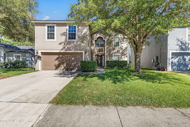 view of front of house featuring a garage and a front yard