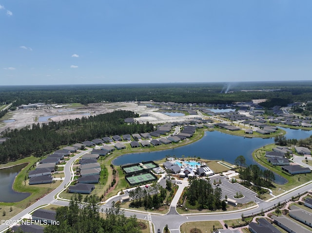 birds eye view of property featuring a water view and a residential view