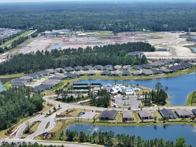 aerial view with a residential view and a water view