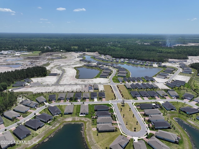 drone / aerial view with a residential view and a water view