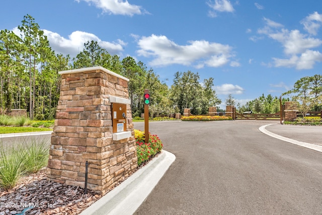 view of road featuring a gated entry