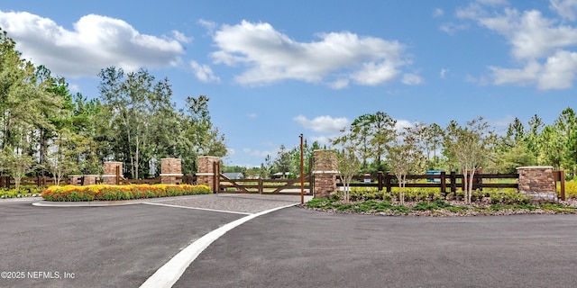 view of street featuring a gate