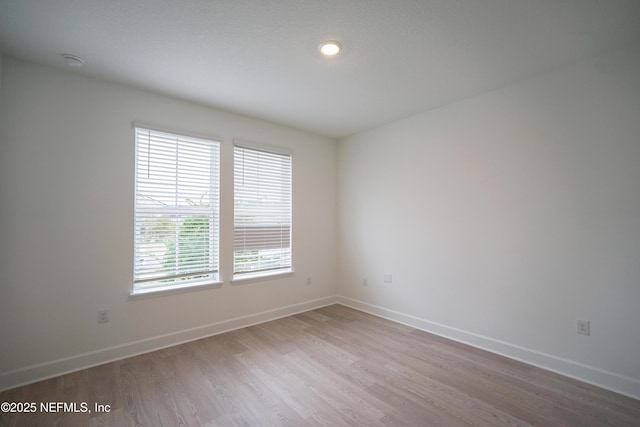 empty room featuring hardwood / wood-style floors