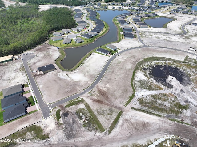 aerial view with a water view and a residential view