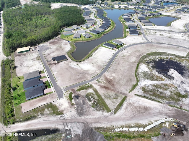 birds eye view of property with a residential view and a water view