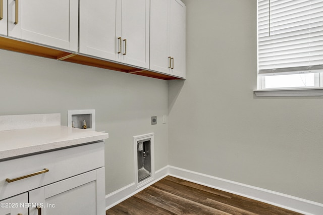 washroom with washer hookup, dark wood-style flooring, cabinet space, electric dryer hookup, and baseboards