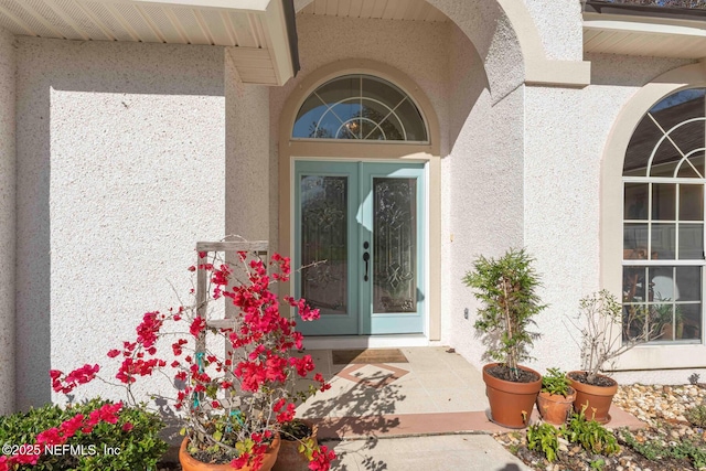 entrance to property featuring french doors