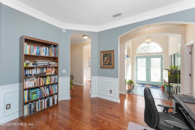 office with hardwood / wood-style floors, crown molding, and french doors