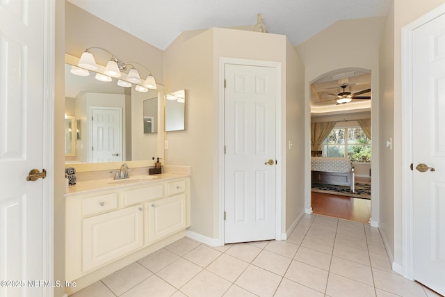 bathroom featuring tile patterned flooring, ceiling fan, and vanity