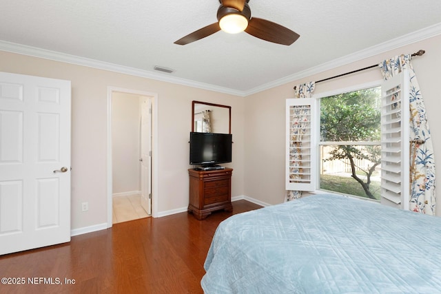 bedroom with dark hardwood / wood-style flooring, ceiling fan, and crown molding