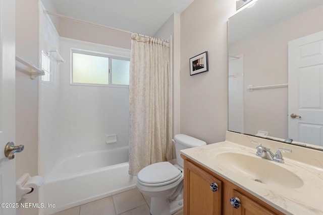 full bathroom featuring tile patterned flooring, vanity, toilet, and shower / bath combo with shower curtain