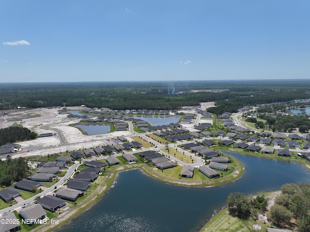 drone / aerial view with a water view and a residential view