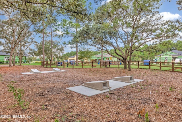 view of storm shelter with fence