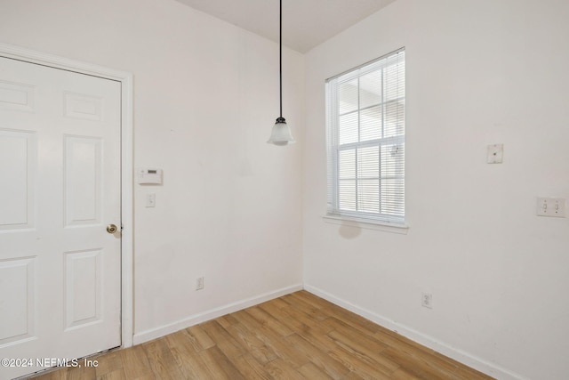 empty room with light hardwood / wood-style floors