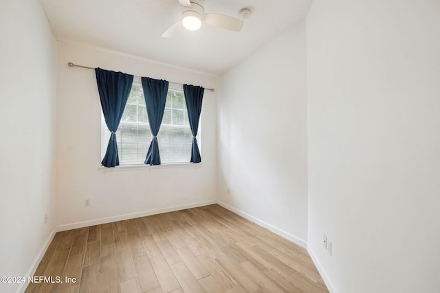 unfurnished room with ceiling fan and light wood-type flooring