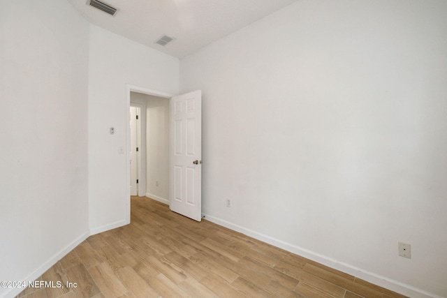 spare room featuring light wood-type flooring