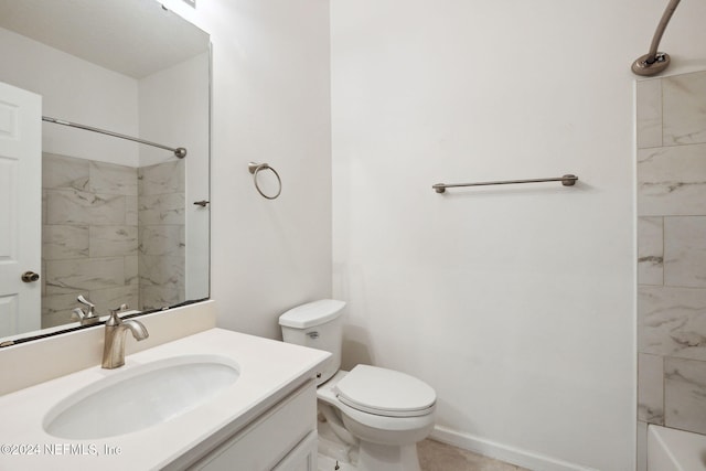 full bathroom featuring vanity, tiled shower / bath combo, and toilet