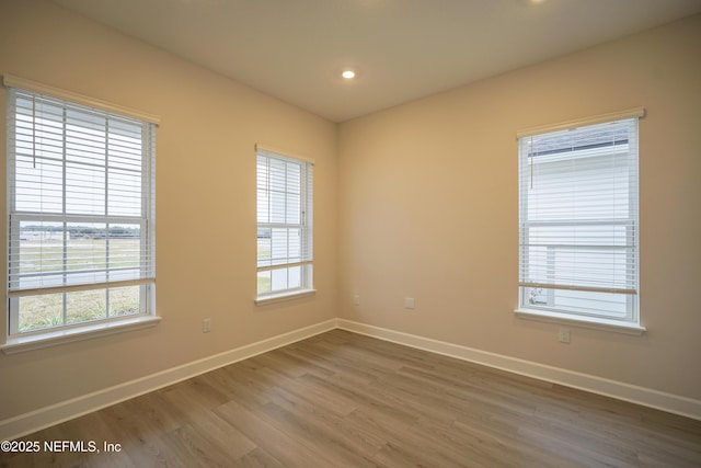 empty room featuring dark wood-type flooring