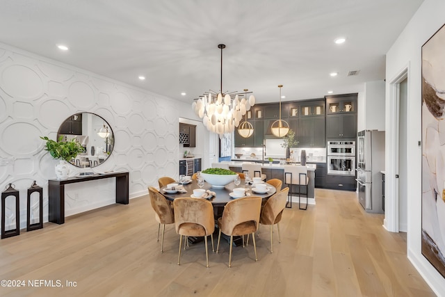 dining space with recessed lighting, visible vents, light wood-style flooring, baseboards, and wallpapered walls