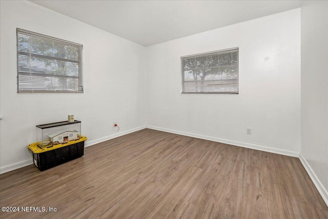 empty room featuring hardwood / wood-style flooring