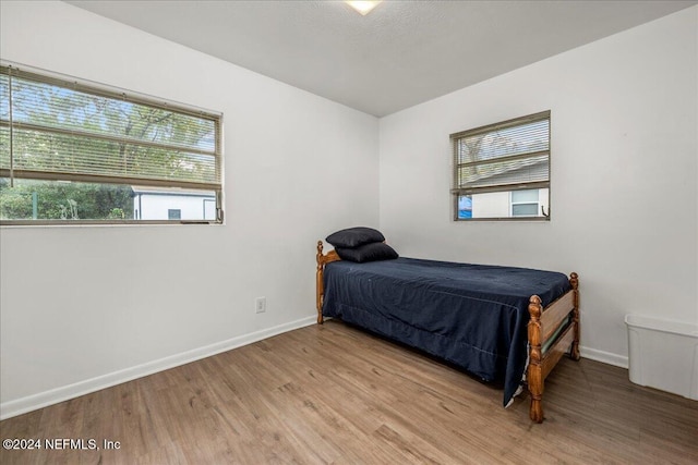 bedroom with light wood-type flooring