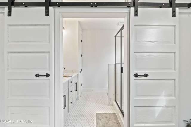 bathroom featuring an enclosed shower and vanity