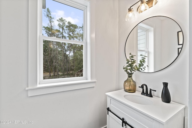 bathroom with a healthy amount of sunlight and vanity