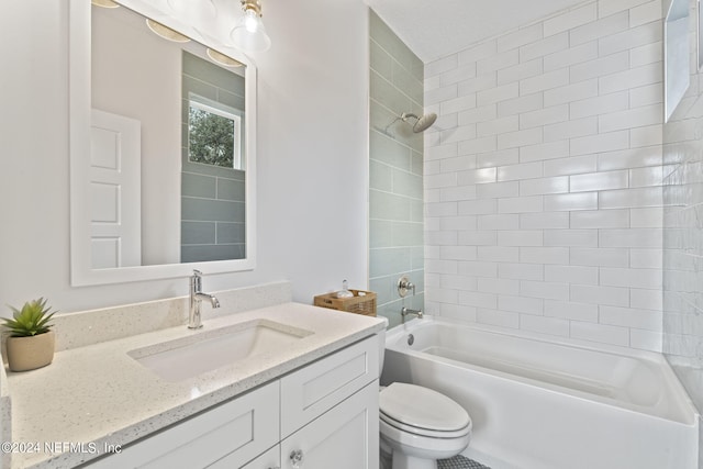 full bathroom featuring toilet, vanity, and tiled shower / bath