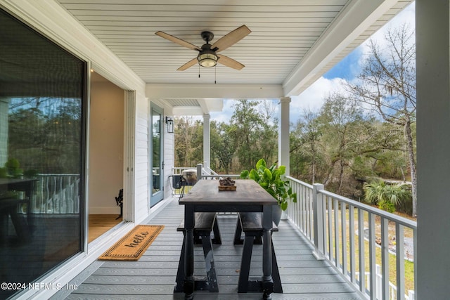 wooden deck featuring ceiling fan