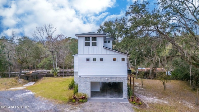 exterior space with a yard and a carport