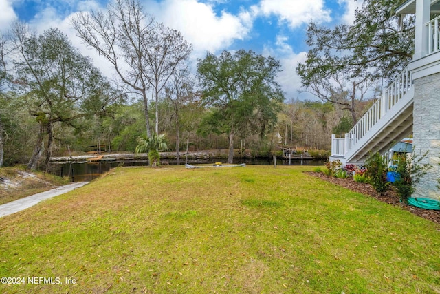 view of yard with a water view