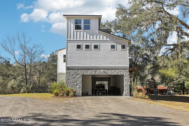 view of side of home featuring a garage