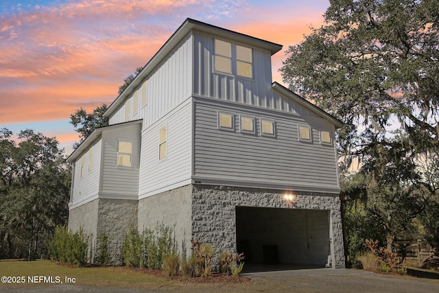 property exterior at dusk with a garage