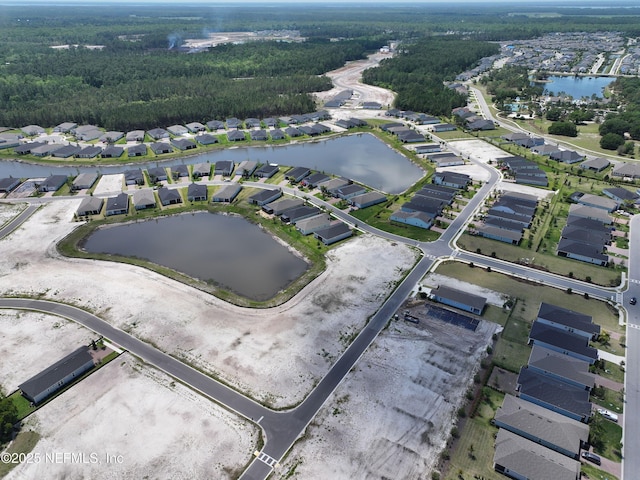 bird's eye view featuring a water view and a residential view