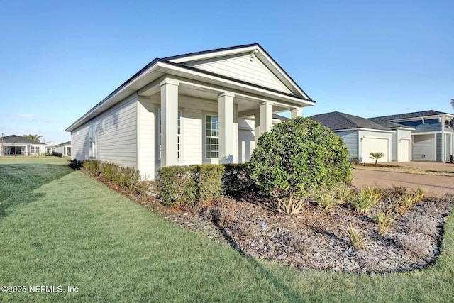 view of side of home featuring a lawn