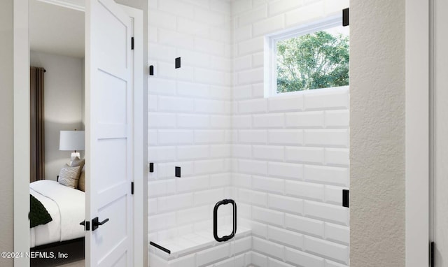 bathroom with a shower with shower door