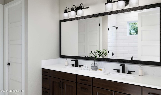 bathroom featuring vanity and a shower