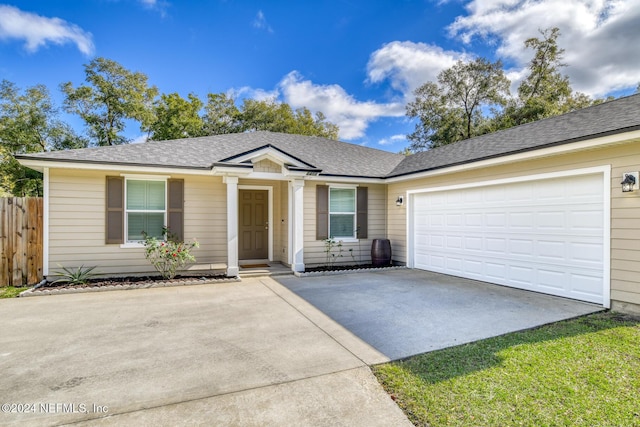 ranch-style home featuring a garage