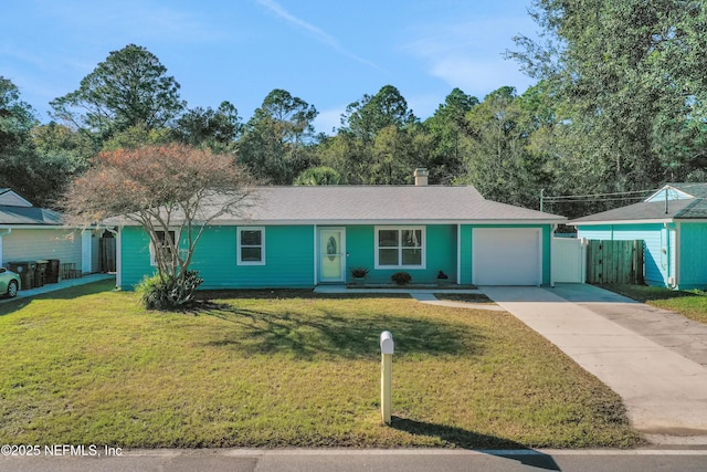 single story home featuring a garage and a front lawn