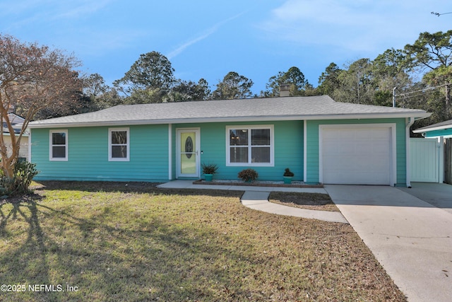 single story home with a garage and a front yard