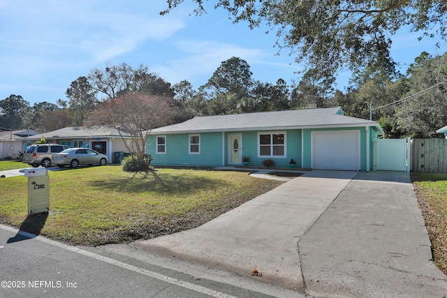 single story home featuring a garage and a front lawn