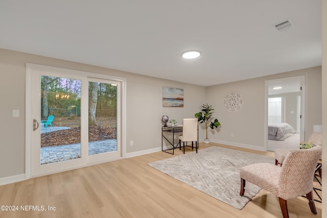 living area with wood-type flooring