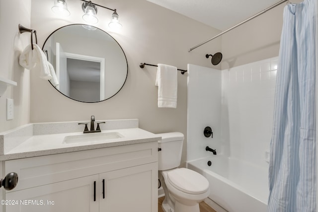 full bathroom with toilet, vanity, and shower / tub combo with curtain