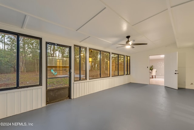 unfurnished sunroom with ceiling fan and a wealth of natural light