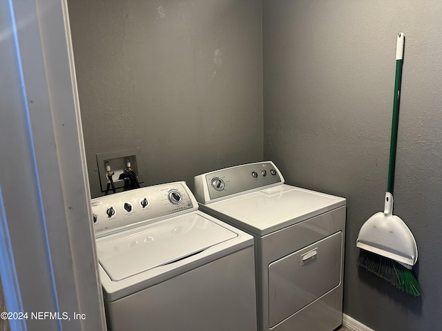 laundry room featuring washing machine and clothes dryer