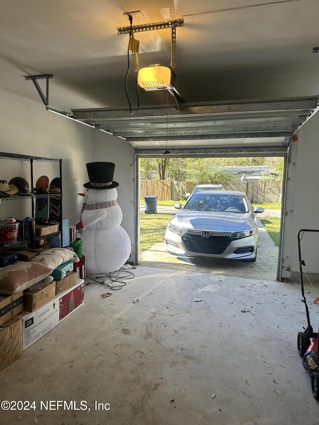 garage featuring a garage door opener