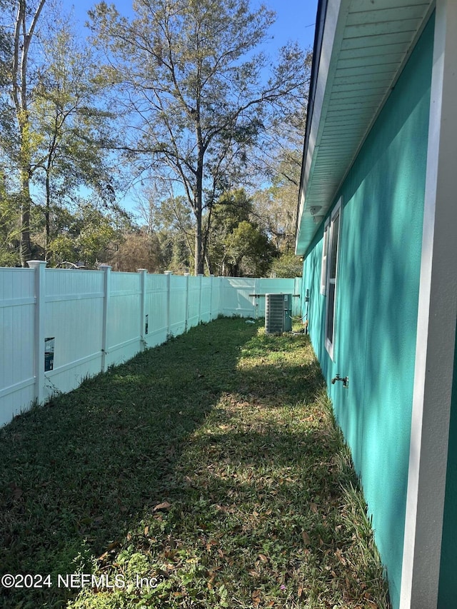 view of yard with central AC