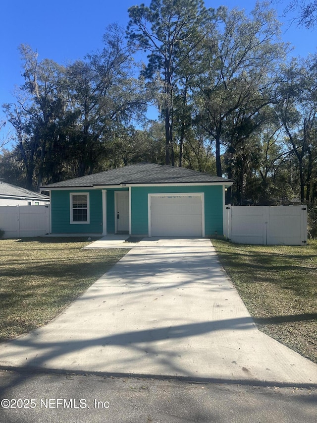 view of front of house with a garage and a front yard