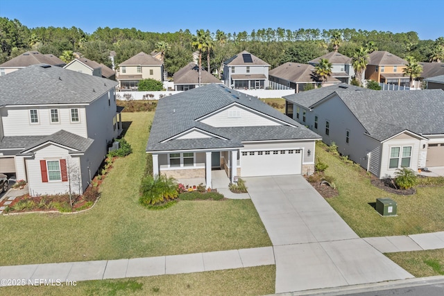 front facade featuring a garage and a front yard