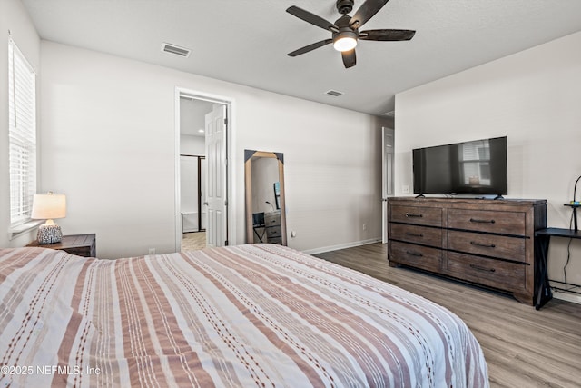 bedroom with hardwood / wood-style flooring and ceiling fan